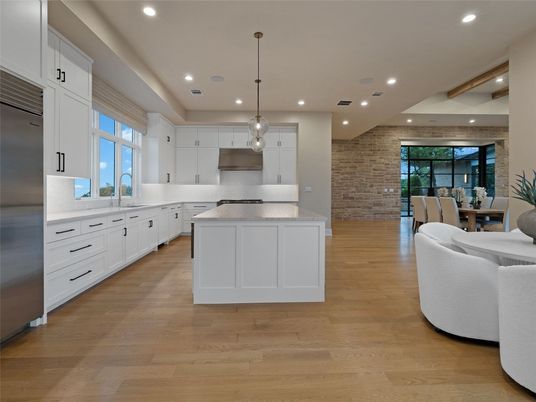 Dining room, Interior, Kitchen, Pendant Lights, Recessed Lighting, Stainless Steel Appliances, Stone Walls, Wood Texture Flooring