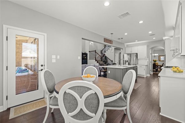 Dining room, Interior, Kitchen, Pendant Lights, Recessed Lighting, Stainless Steel Appliances, Wood Texture Flooring