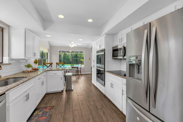 Dining room, Interior, Kitchen, Recessed Lighting, Stainless Steel Appliances, Wood Texture Flooring