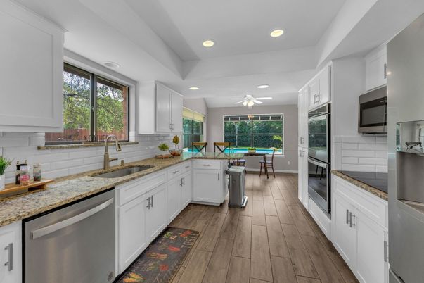 Dining room, Interior, Kitchen, Recessed Lighting, Stainless Steel Appliances, Wood Texture Flooring