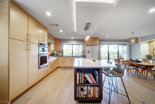 Chandelier, Dining room, Interior, Kitchen, Pendant Lights, Recessed Lighting, Stainless Steel Appliances, Wood Texture Flooring