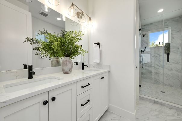 Bathroom, Dual Sink Vanities, Glass Shower, Interior, Marble, Marble Walls, Recessed Lighting