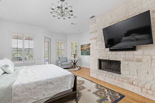 Bedroom, Fireplace, Interior, Pendant Lights, Stone Walls, Wood Texture Flooring