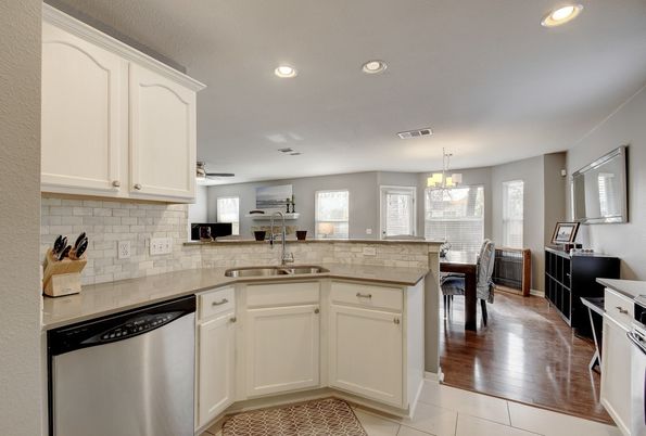 Chandelier, Dining room, Interior, Kitchen, Recessed Lighting, Stainless Steel Appliances, Wood Texture Flooring