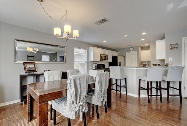 Chandelier, Dining room, Interior, Kitchen, Recessed Lighting, Stainless Steel Appliances, Wood Texture Flooring