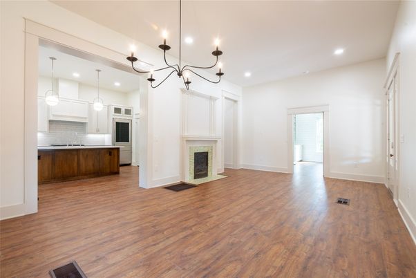 Chandelier, Empty room, Fireplace, Interior, Kitchen, Pendant Lights, Recessed Lighting, Wood Texture Flooring