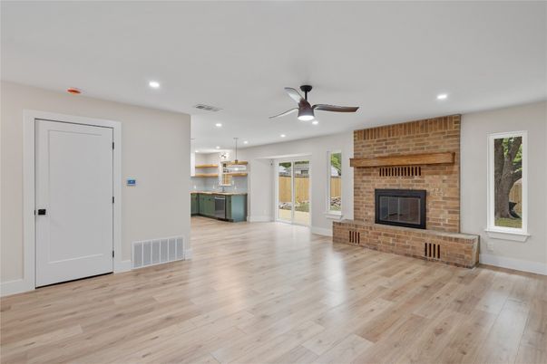 Empty room, Fireplace, Interior, Pendant Lights, Recessed Lighting, Stone Walls, Wood Texture Flooring
