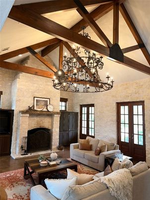 Chandelier, Fireplace, Interior, Living room, Stone Walls, Wooden Beams, Wood Texture Flooring