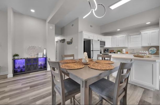 Dining room, Interior, Kitchen, Pendant Lights, Recessed Lighting, Stainless Steel Appliances, Wood Texture Flooring