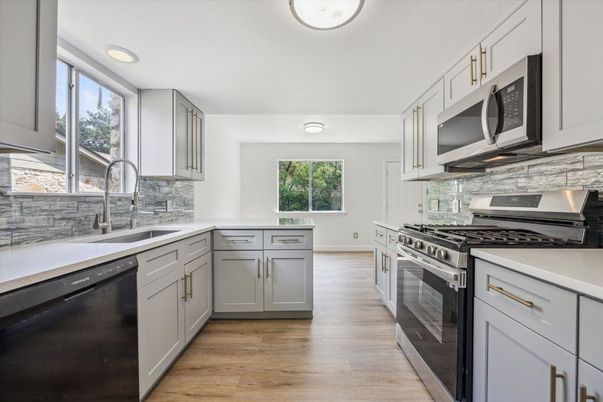 Interior, Kitchen, Recessed Lighting, Stainless Steel Appliances, Wood Texture Flooring