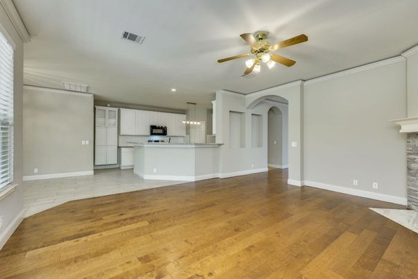 Empty room, Interior, Kitchen, Pendant Lights, Recessed Lighting, Stainless Steel Appliances, Wood Texture Flooring