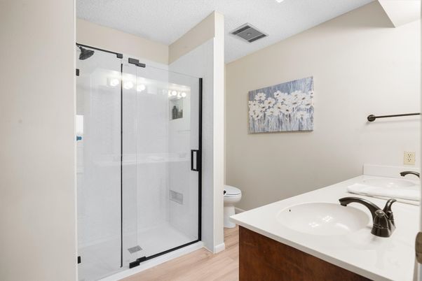 Bathroom, Dual Sink Vanities, Glass Shower, Interior, Wood Texture Flooring