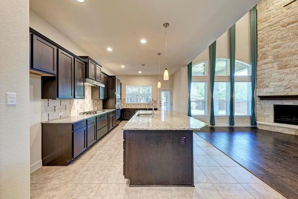 Fireplace, Interior, Kitchen, Pendant Lights, Recessed Lighting, Stone Walls, Wood Texture Flooring