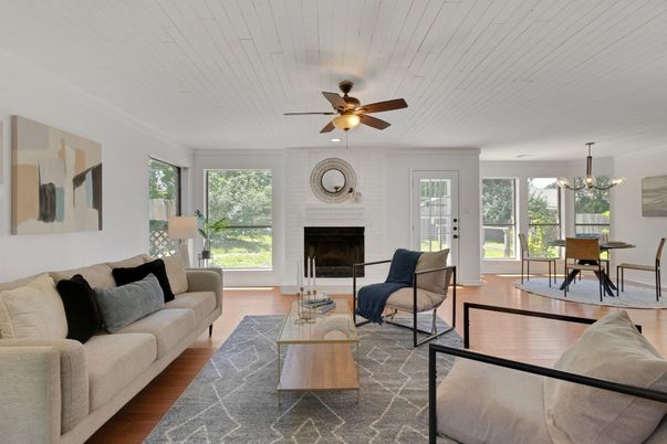 Chandelier, Dining room, Fireplace, Interior, Living room, Stone Walls, Wood Texture Flooring