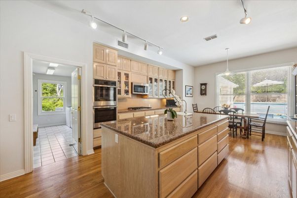 Dining room, Interior, Kitchen, Pendant Lights, Recessed Lighting, Stainless Steel Appliances, Wood Texture Flooring