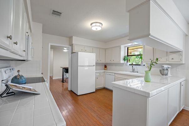 Interior, Kitchen, Tile Countertops, Wood Texture Flooring