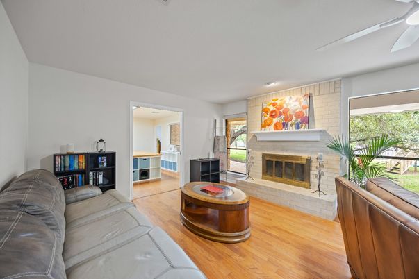 Fireplace, Interior, Living room, Recessed Lighting, Stone Walls, Wood Texture Flooring