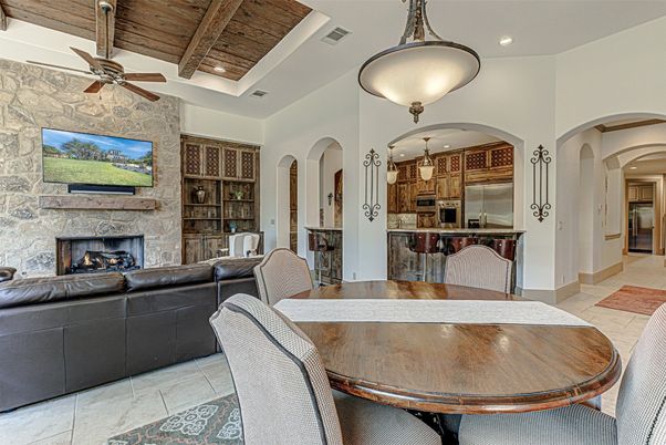Dining room, Fireplace, Interior, Kitchen, Living room, Pendant Lights, Recessed Lighting, Stainless Steel Appliances, Stone Walls, Wooden Beams, Wooden Ceilings