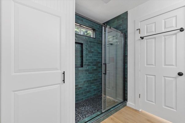 Bathroom, Glass Shower, Interior, Stone Walls, Wood Texture Flooring