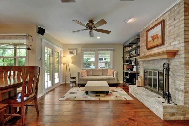 Dining room, Fireplace, Interior, Living room, Recessed Lighting, Stone Walls, Wood Texture Flooring