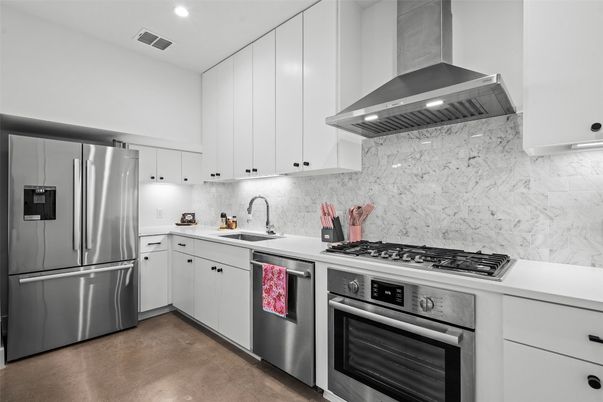 Interior, Kitchen, Marble Walls, Recessed Lighting, Stainless Steel Appliances