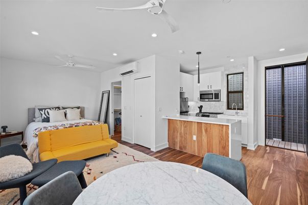 Bedroom, Dining room, Interior, Kitchen, Living room, Pendant Lights, Recessed Lighting, Stainless Steel Appliances, Wood Texture Flooring