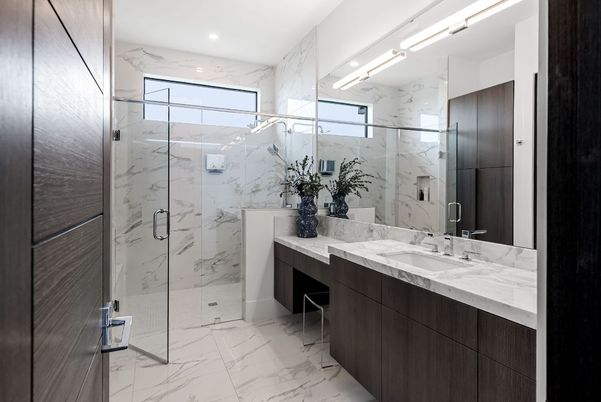 Bathroom, Dual Sink Vanities, Glass Shower, Interior, Marble, Marble Walls, Recessed Lighting