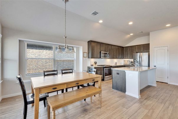 Dining room, Interior, Kitchen, Pendant Lights, Recessed Lighting, Stainless Steel Appliances, Wood Texture Flooring