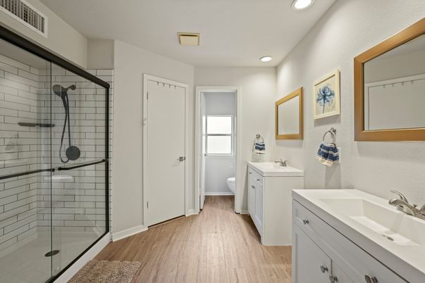 Bathroom, Dual Sink Vanities, Glass Shower, Interior, Recessed Lighting, Wood Texture Flooring
