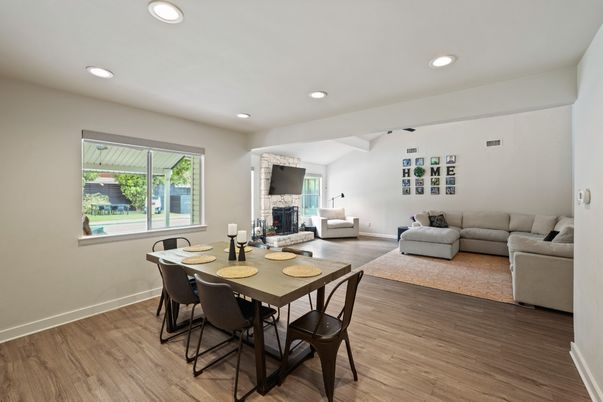 Dining room, Fireplace, Interior, Living room, Recessed Lighting, Wood Texture Flooring