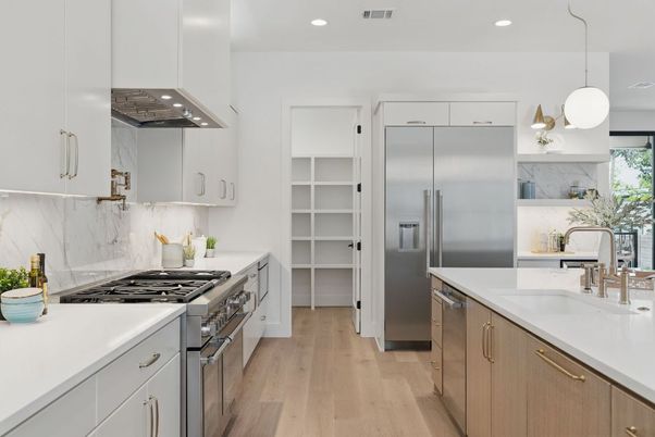 Interior, Kitchen, Marble Walls, Pendant Lights, Recessed Lighting, Stainless Steel Appliances, Wood Texture Flooring