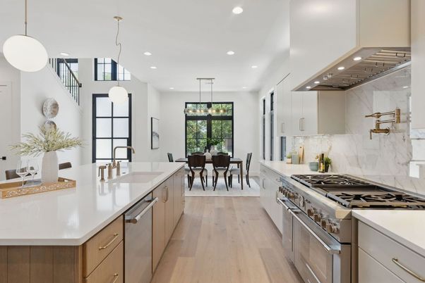 Dining room, Interior, Kitchen, Marble Walls, Pendant Lights, Recessed Lighting, Stainless Steel Appliances, Wood Texture Flooring