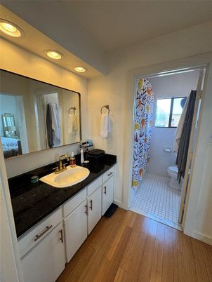 Bathroom, Dual Sink Vanities, Interior, Recessed Lighting, Wood Texture Flooring