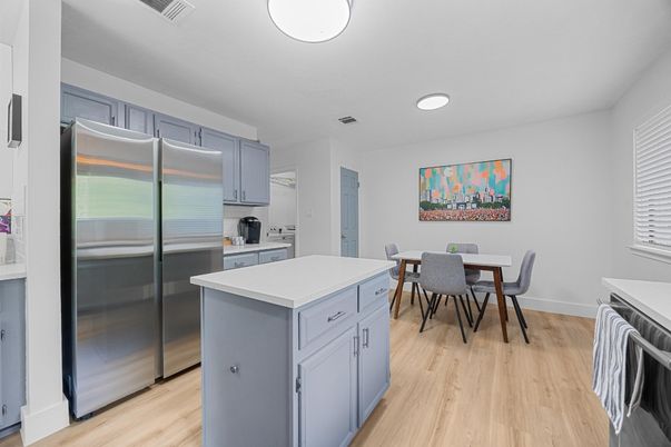 Dining room, Interior, Kitchen, Recessed Lighting, Stainless Steel Appliances, Wood Texture Flooring