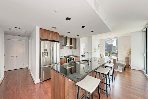 Chandelier, Dining room, Interior, Kitchen, Pendant Lights, Recessed Lighting, Stainless Steel Appliances, Wood Texture Flooring