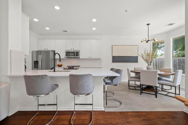 Dining room, Interior, Kitchen, Pendant Lights, Recessed Lighting, Stainless Steel Appliances, Wood Texture Flooring