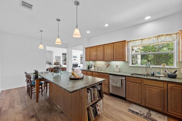 Dining room, Interior, Kitchen, Pendant Lights, Recessed Lighting, Stainless Steel Appliances, Wood Texture Flooring