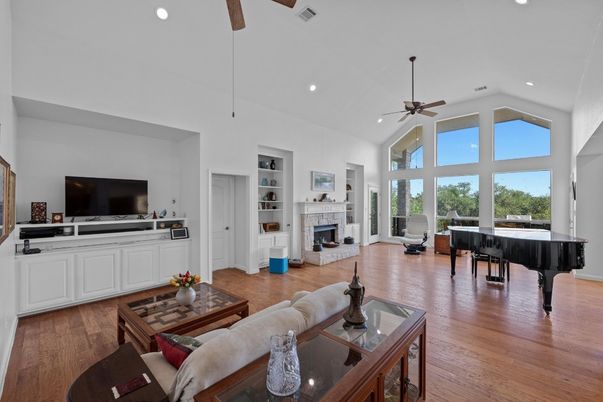 Fireplace, Interior, Living room, Piano, Recessed Lighting, Wood Texture Flooring