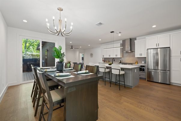 Chandelier, Dining room, Interior, Kitchen, Pendant Lights, Recessed Lighting, Stainless Steel Appliances, Wood Texture Flooring