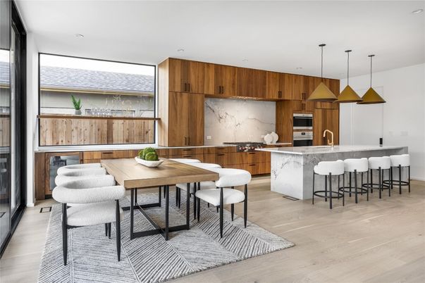 Dining room, Interior, Kitchen, Marble Walls, Pendant Lights, Recessed Lighting, Stainless Steel Appliances, Wood Texture Flooring