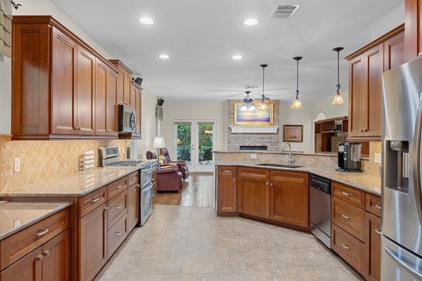 Fireplace, Interior, Kitchen, Pendant Lights, Recessed Lighting, Stainless Steel Appliances, Wood Texture Flooring