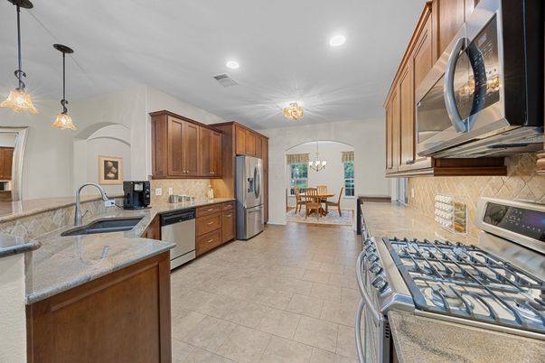 Chandelier, Dining room, Interior, Kitchen, Pendant Lights, Recessed Lighting, Stainless Steel Appliances