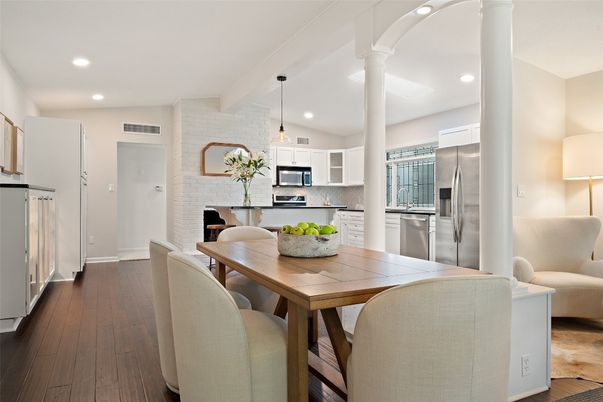 Dining room, Fireplace, Interior, Kitchen, Pendant Lights, Recessed Lighting, Stainless Steel Appliances, Stone Walls, Wood Texture Flooring