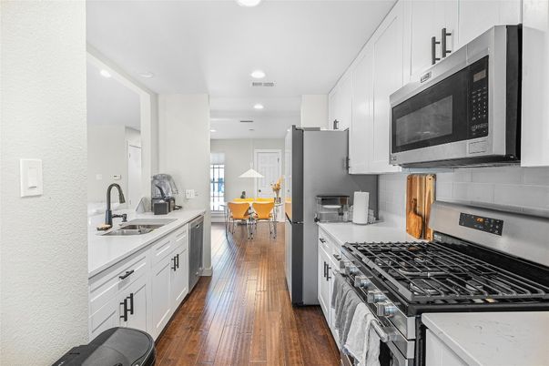 Dining room, Interior, Kitchen, Pendant Lights, Recessed Lighting, Stainless Steel Appliances, Wood Texture Flooring