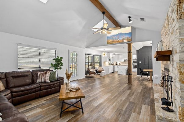 Chandelier, Dining room, Fireplace, Interior, Kitchen, Living room, Pendant Lights, Stone Walls, Wood Texture Flooring
