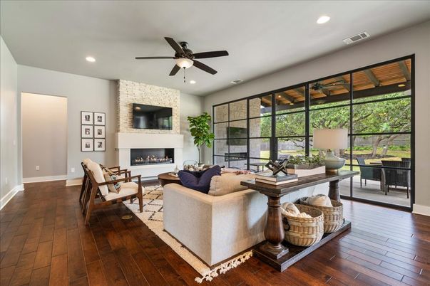 Fireplace, Interior, Living room, Recessed Lighting, Stone Walls, Wood Texture Flooring