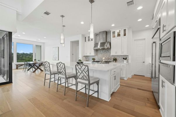 Dining room, Interior, Kitchen, Pendant Lights, Recessed Lighting, Stainless Steel Appliances, Wood Texture Flooring