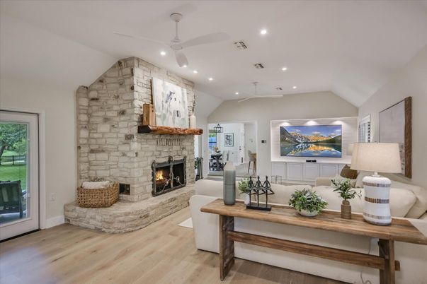 Fireplace, Interior, Living room, Recessed Lighting, Stone Walls, Wood Texture Flooring