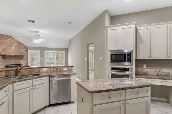 Interior, Kitchen, Recessed Lighting, Stainless Steel Appliances, Stone Walls