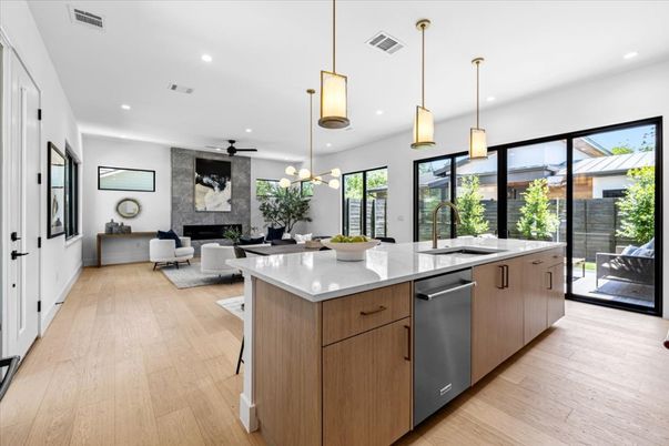 Fireplace, Interior, Kitchen, Living room, Pendant Lights, Recessed Lighting, Stainless Steel Appliances, Wood Texture Flooring